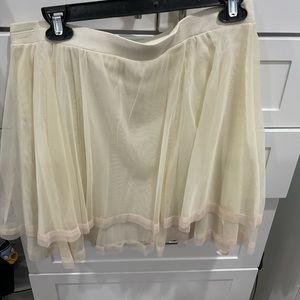 Look like Carrie in the Sex and the City intro. This skirt is sheer & fabulous.